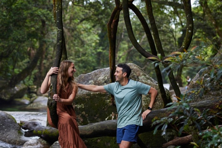 Man and woman standing next to Josephine Falls
