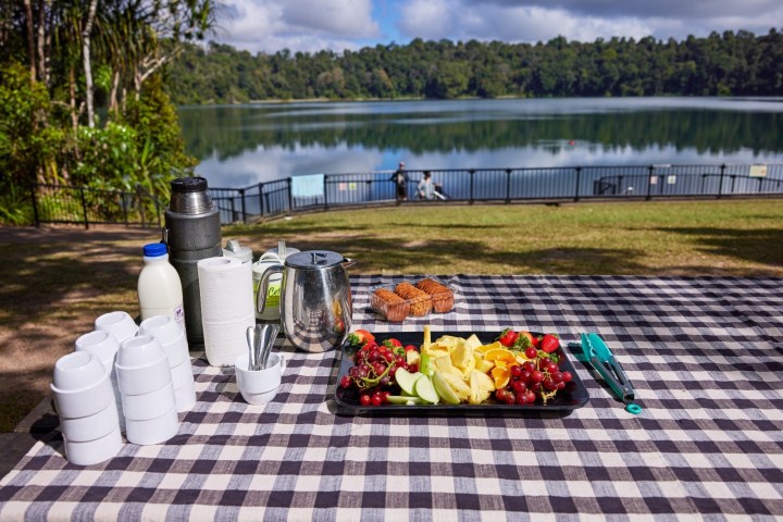 Food on a picnic table during a Lake Eacham day tour in Cairns