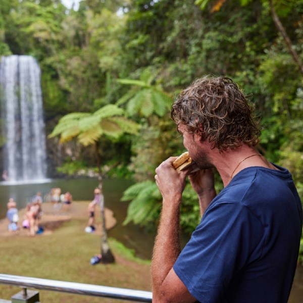 Man having food at Milla Milla Waterfalls