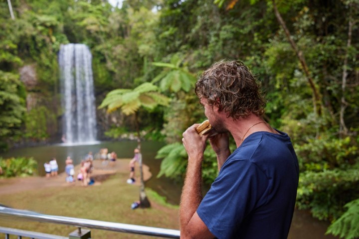 Man having food at Milla Milla Waterfalls