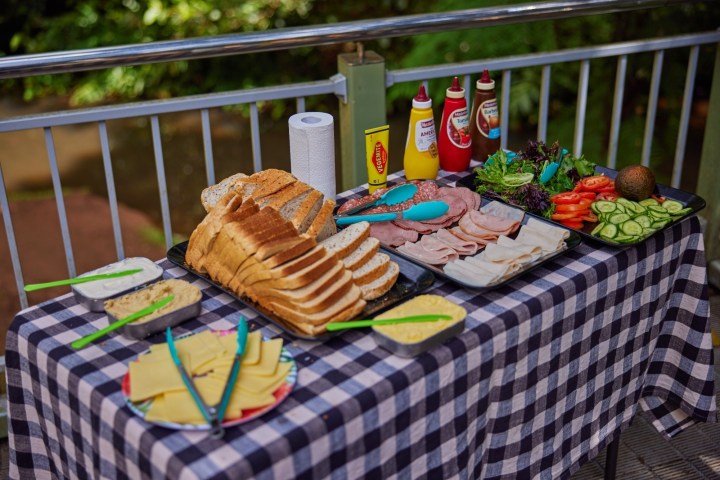 Cake on a wooden fence at Tblands Waterfall Day Tour