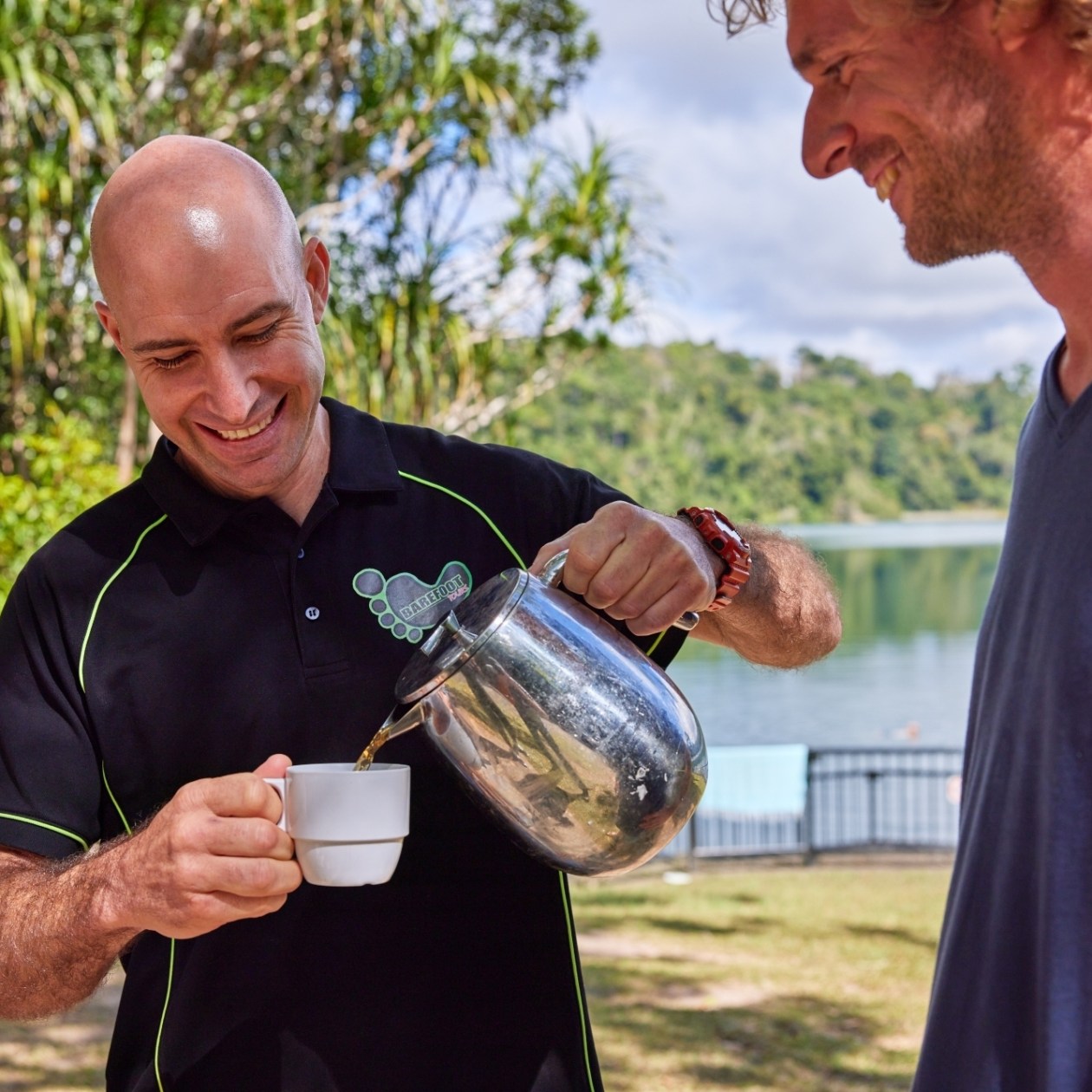 NEW – Other Misc; (C) Barefoot Tours (5)2024 Person holding a glass of wine on a day trip to Cairns